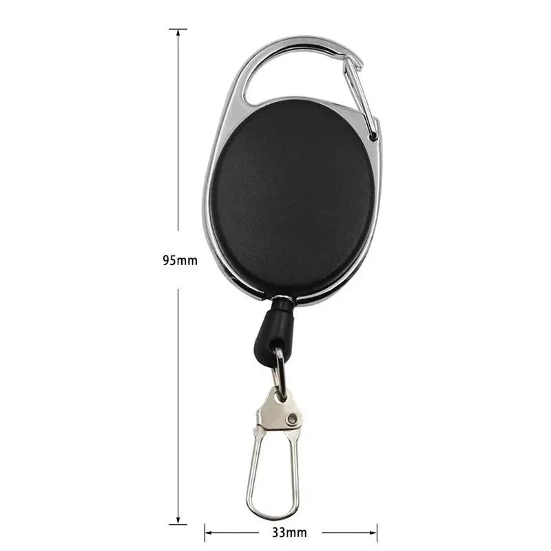 Simples Market retractable badge reel with black oval case, carabiner-style top clip and quick-release bottom clip