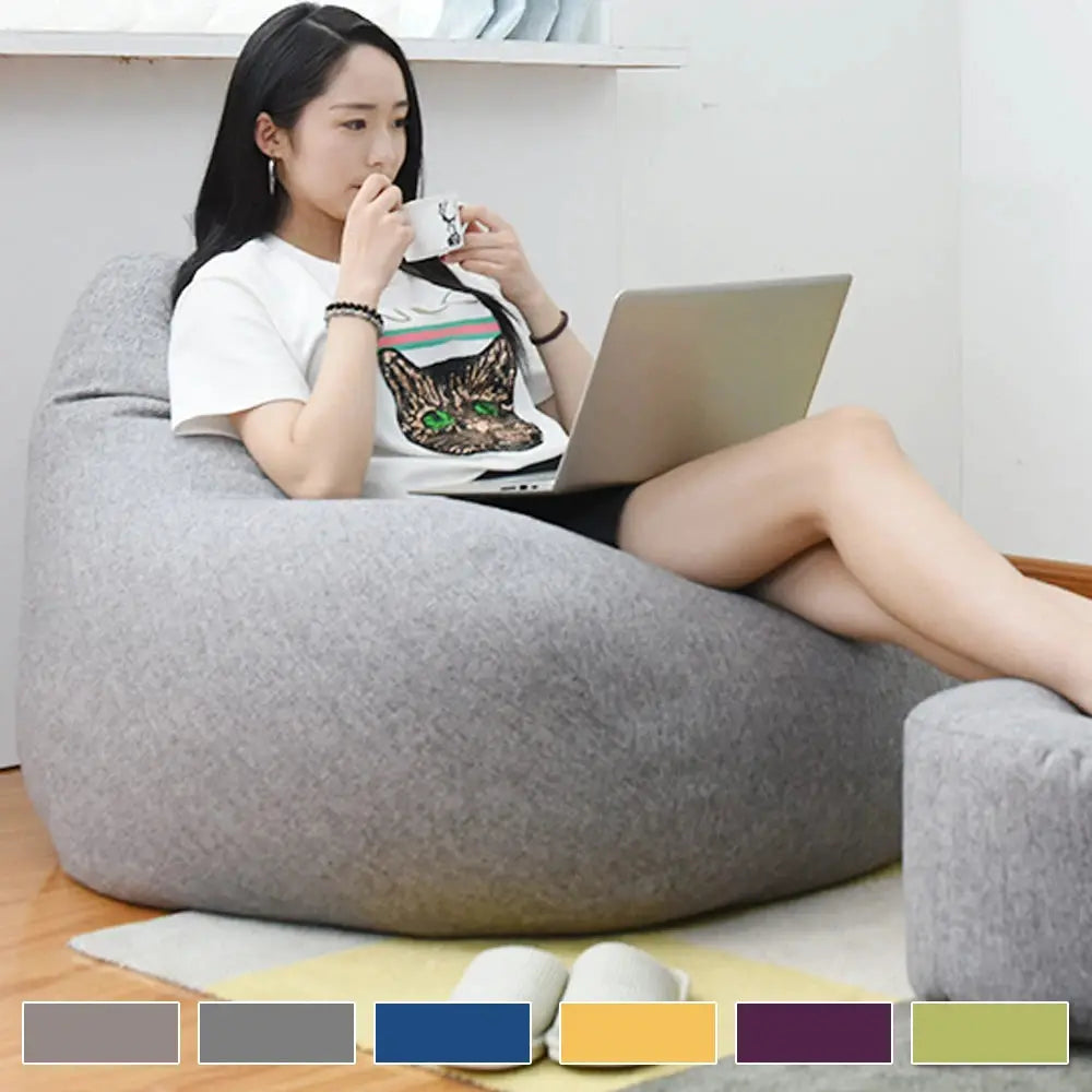 Large bean bag cover in gray fabric; tatami lounger style, no filler.