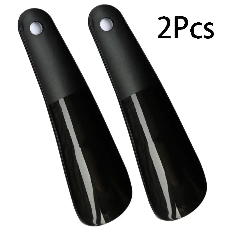 Shoe horns, 2-piece set by Simples Market; black plastic with short handles, 16 cm long