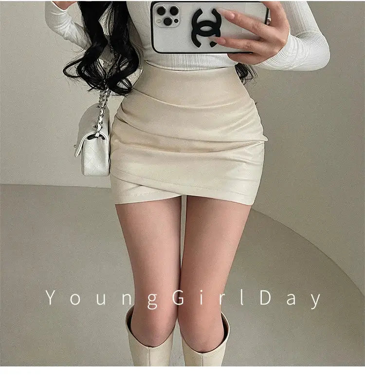 WOMENGAGA PU leather mini skirt, high-waist wrap design, beige cream color