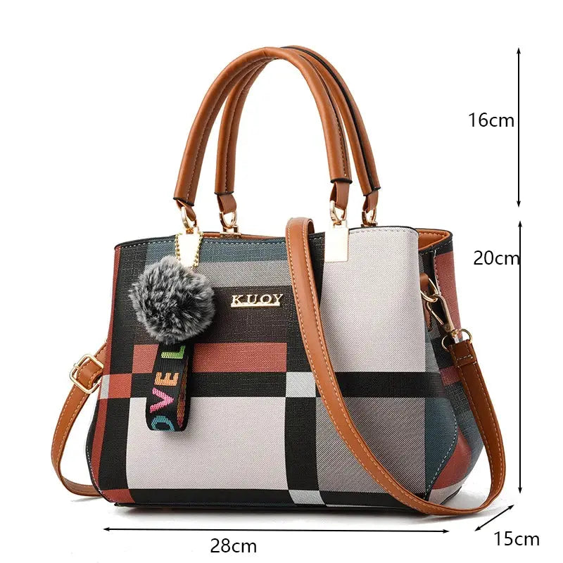 PU leather crossbody bag for women by KUOY with plaid pattern, brown top handles, gold hardware, pom-pom charm.