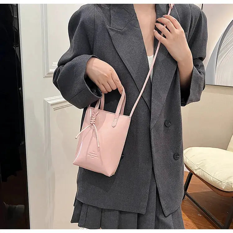 Pink PU leather mini crossbody bag for women with short handles and long strap