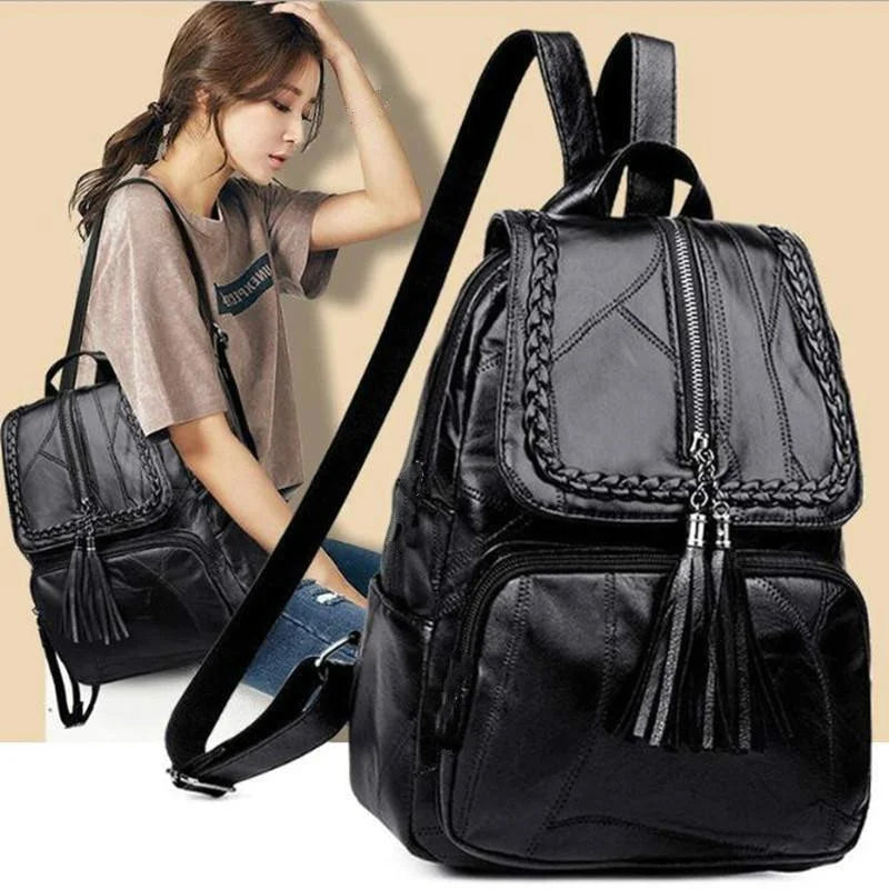 Mini men's black faux leather backpack with braided trim and tassel zippers
