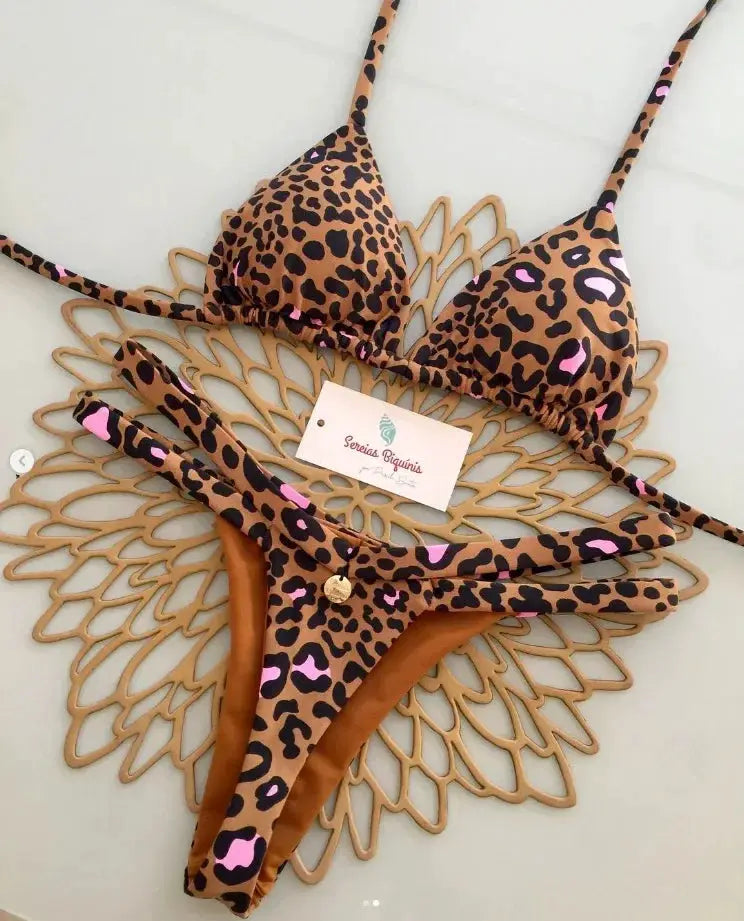 Leopard print bikini set by Simples Market with halter lace-up top and thong bottom, pink accents