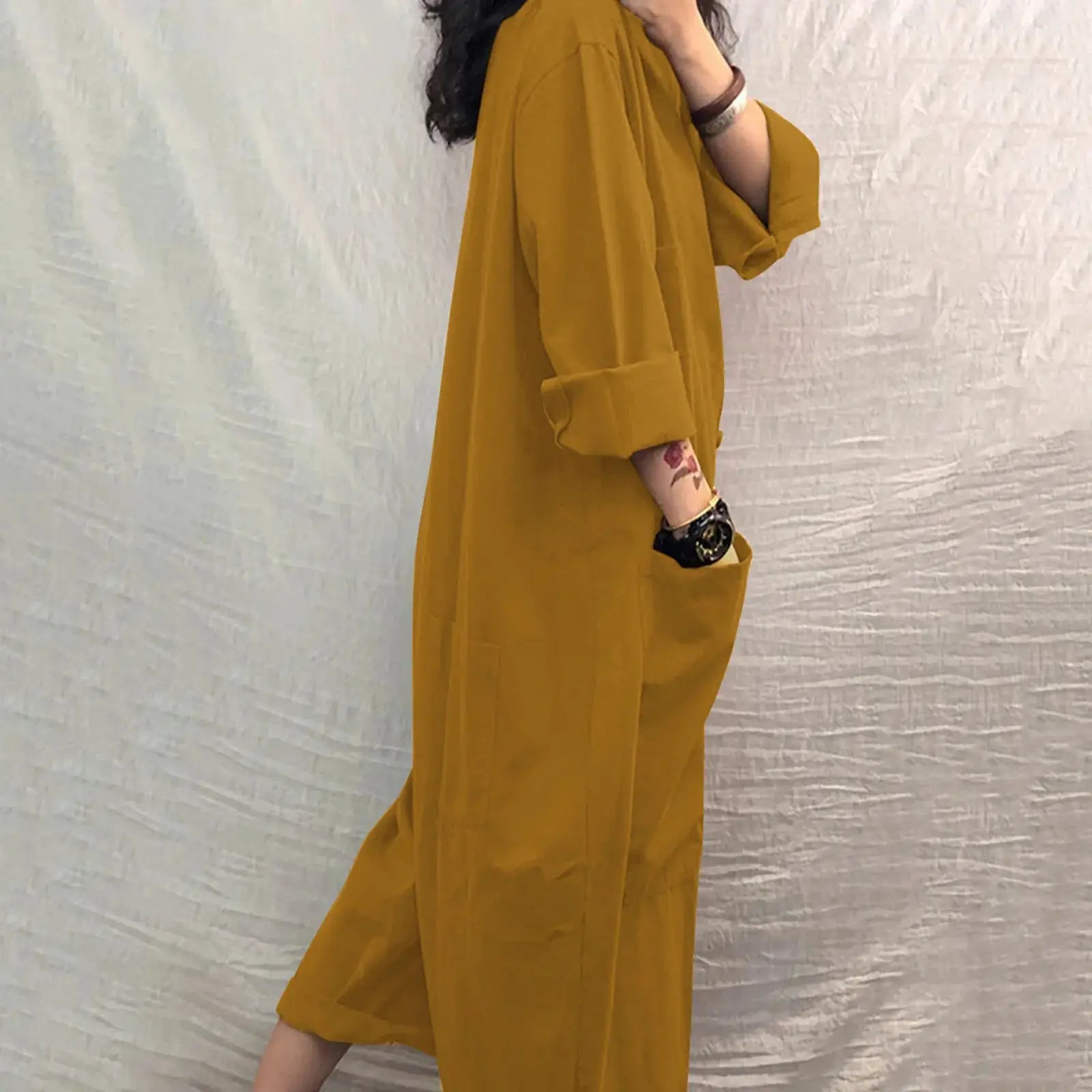 Jumpsuit for women; mustard yellow, loose fit with rolled sleeves and side pocket