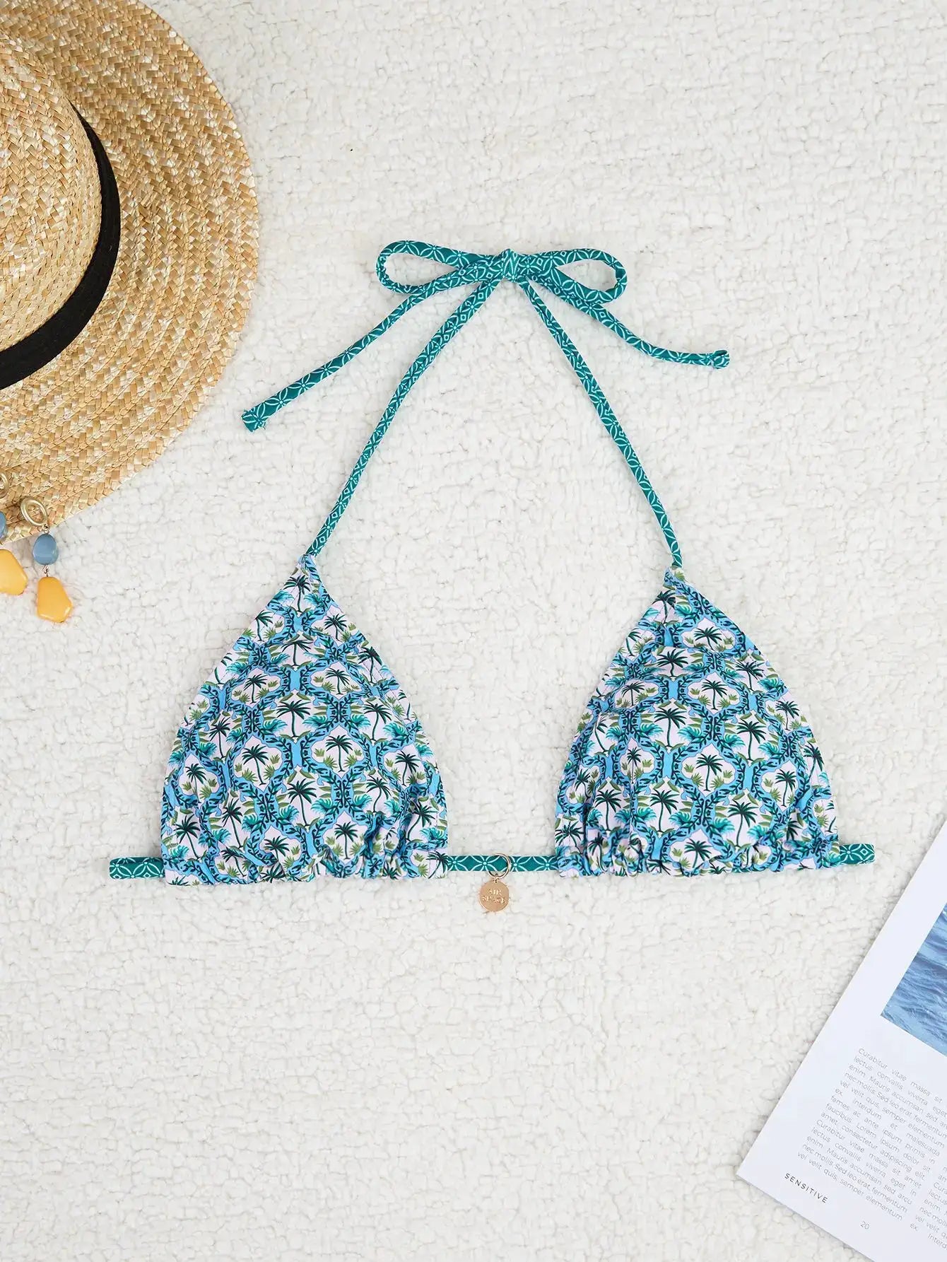 Two-piece triangle bikini set featuring teal tropical-print top and matching Brazilian bottoms with teal tie straps.