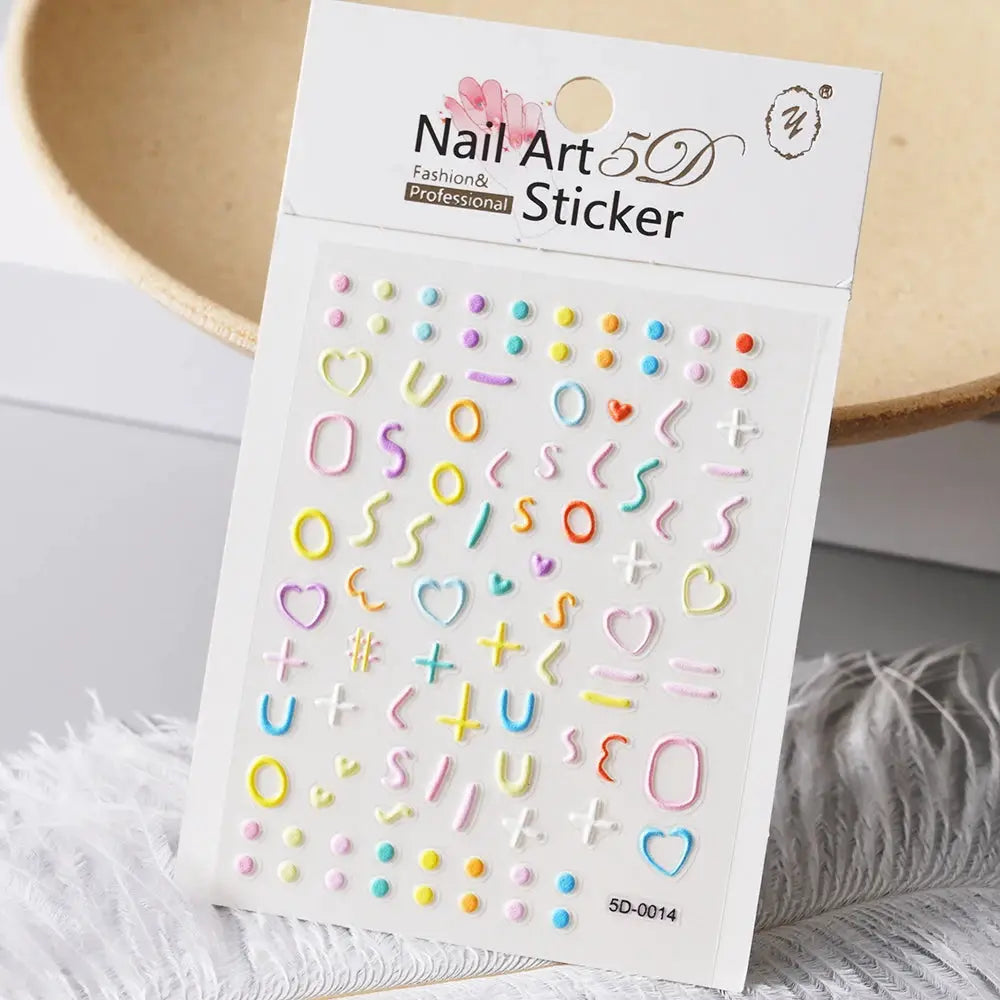 Nail Art 5D sticker sheet by Simples Market with pastel heart, letter and symbol nail charms for manicure