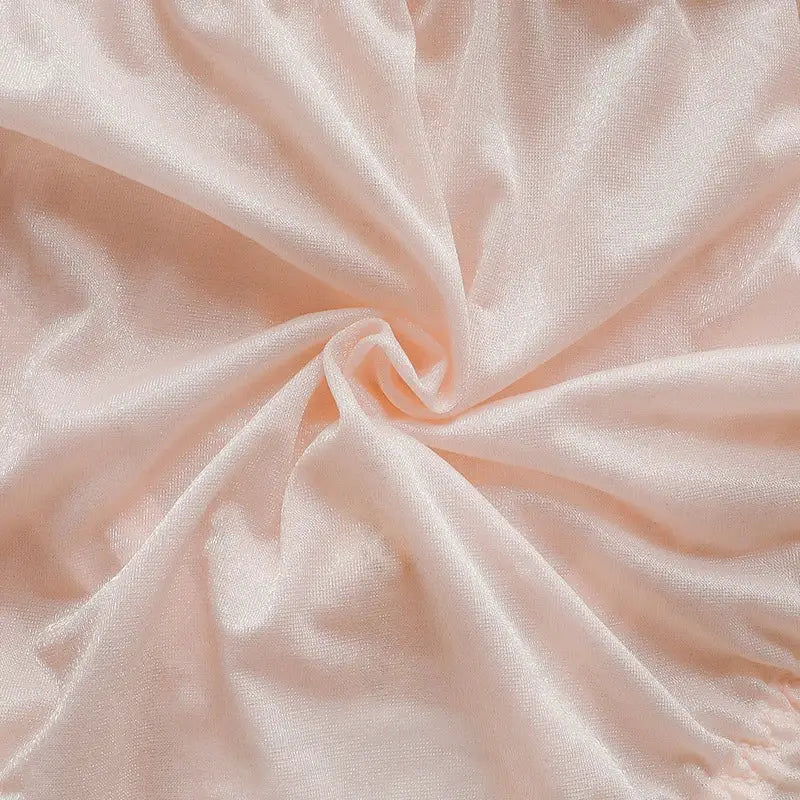 Ice silk fabric close-up in pale pink, soft sheer texture