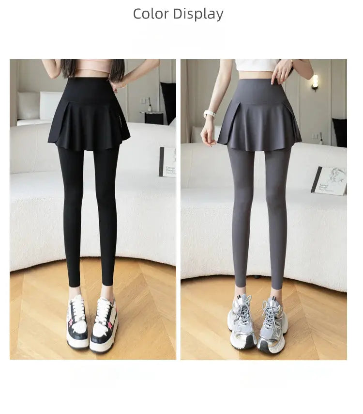 Women’s high-waist faux two-piece leggings with skirt overlay and pocket; two color options: black and gray.