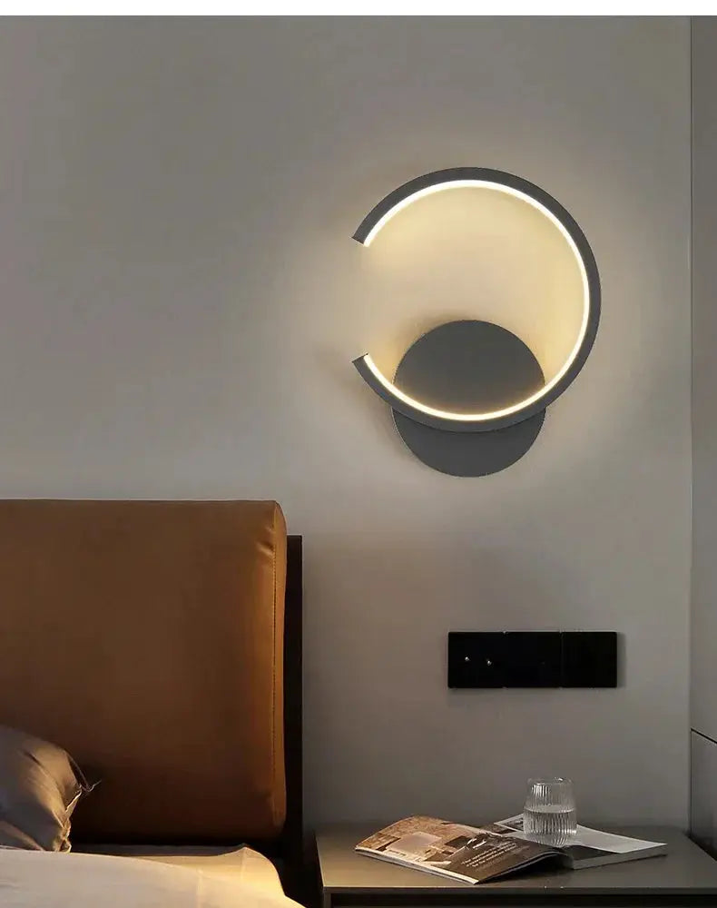 Modern LED wall lamp with circular black metal ring and warm white glow, Nordic home decor
