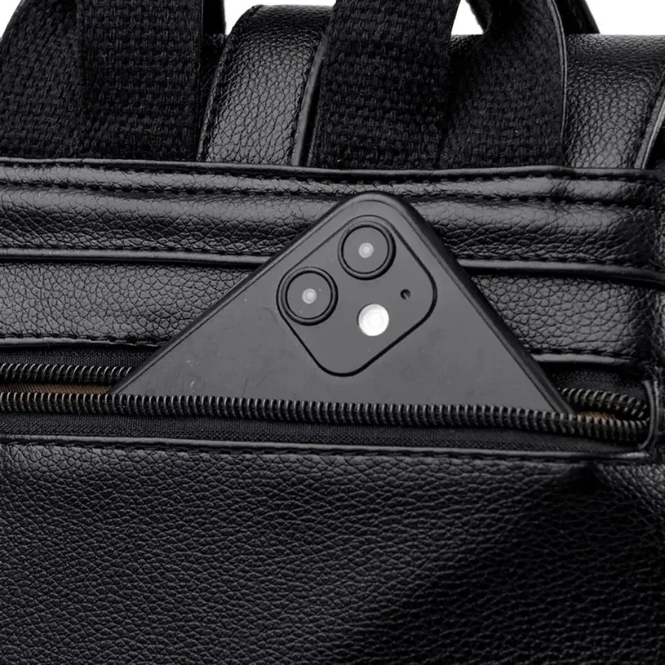 Women's black leather backpack with large capacity and front zipper pocket