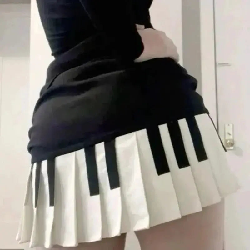 Mini skirt with black and white pleated spliced panels; Y2K Harajuku style