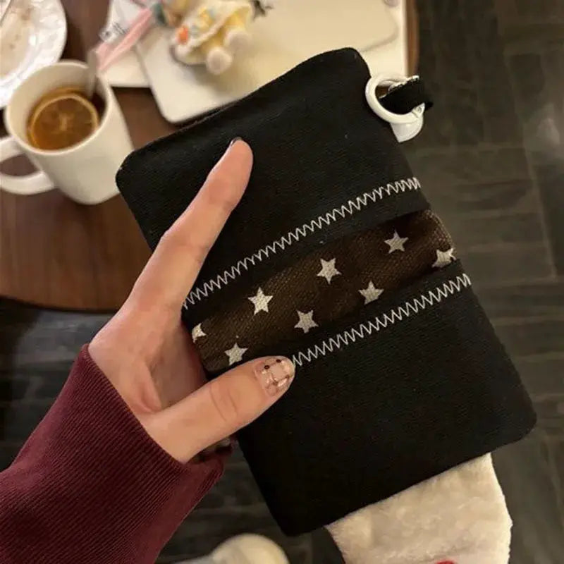 Rice ball card holder coin purse by Simples Market; black canvas with brown star-pattern band and white zigzag stitching