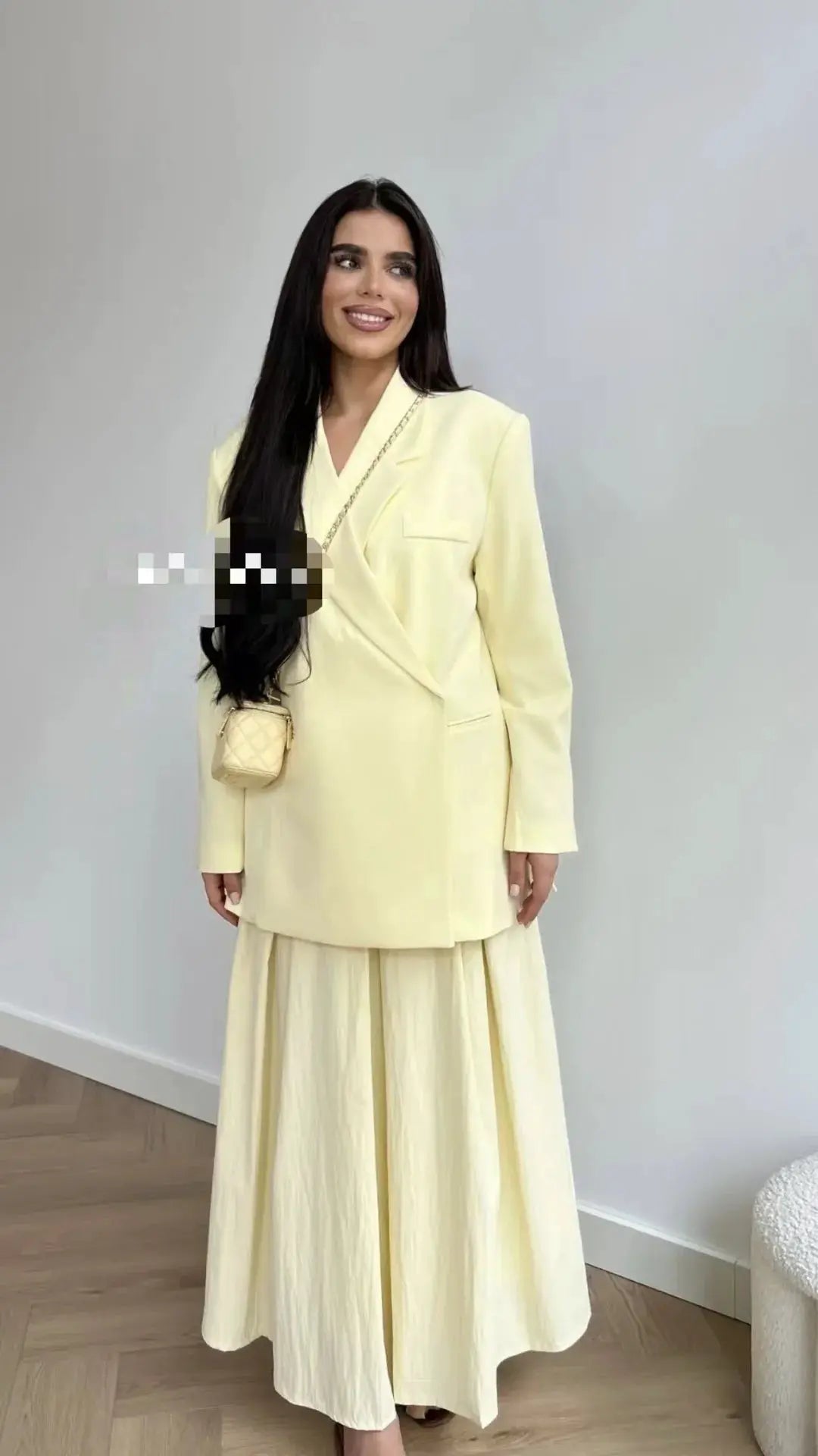 Ladies loose pale yellow blazer suit with lapel collar and matching long skirt, chic formal outfit
