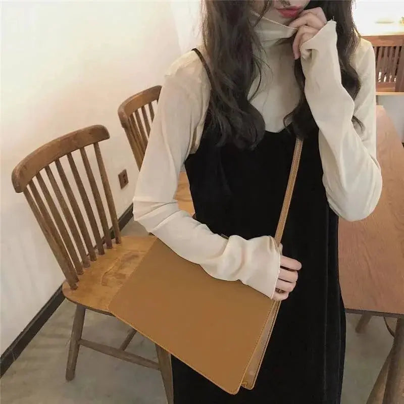 Simples Market women's mesh lace blouse, long-sleeve see-through top in white with a black dress and tan bag