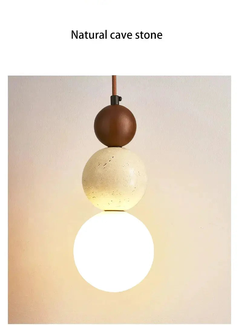 Simples Market cream stone pendant lamp with stacked brown top sphere, beige middle sphere, and glowing LED globe.
