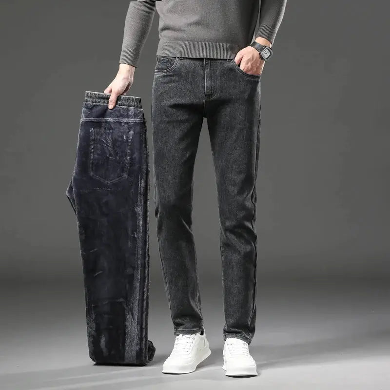 Men's slim-straight dark-wash fleece-lined jeans, two pairs shown (one worn, one folded)
