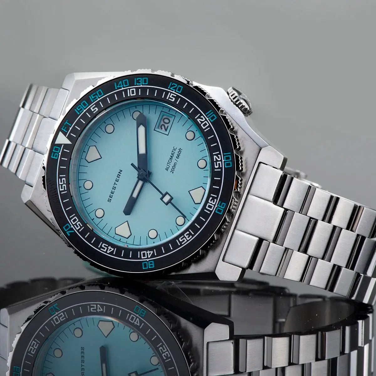 Seestern Sub600T diver watch with light blue dial, ceramic bezel, and stainless steel bracelet.