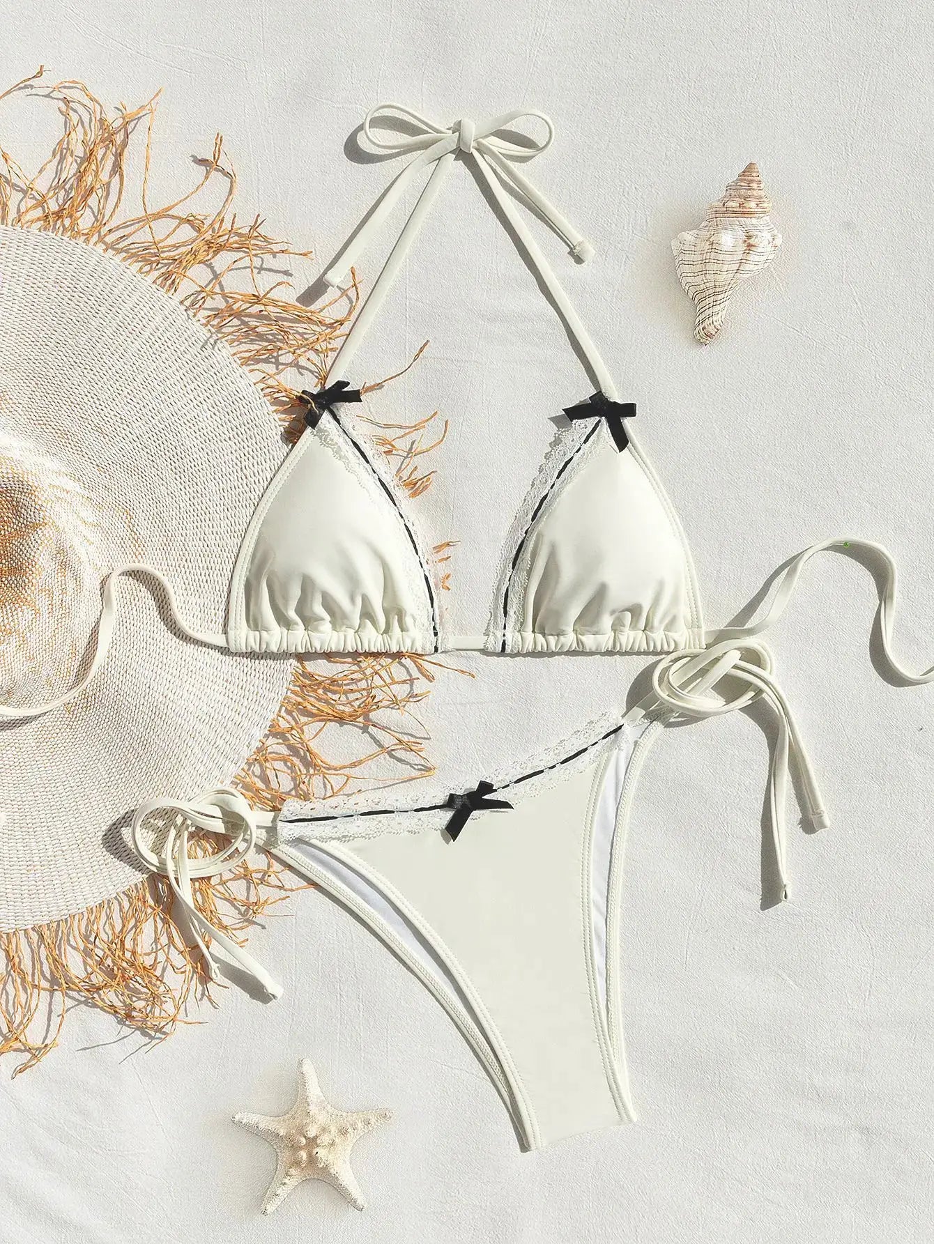 Simples Market white triangle bikini set with push-up top and black bow accents, Brazilian bottoms