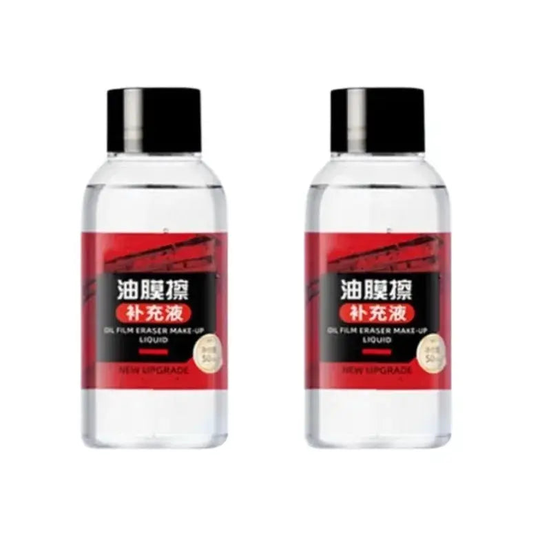 Two clear plastic car glass cleaner bottles with red labels and black caps