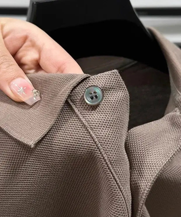 Men's taupe polo shirt with collar and button on textured knit fabric