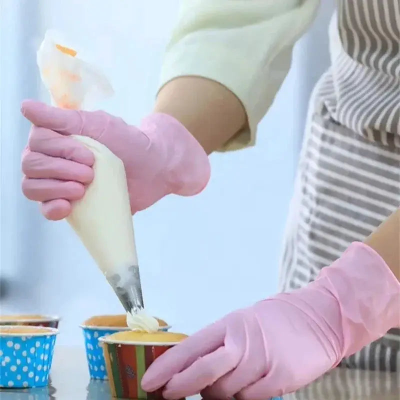 Pink nitrile gloves pair by Simples Market for kitchen and cleaning; piping icing on cupcakes