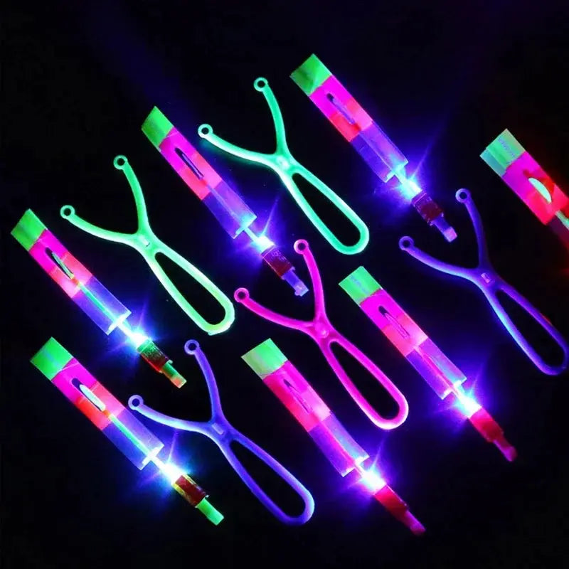 New Light Up Arrow Rocket Helicopter Flying Toys With LED Neon Glow For Parties And Gifts Rubber Band Catapult