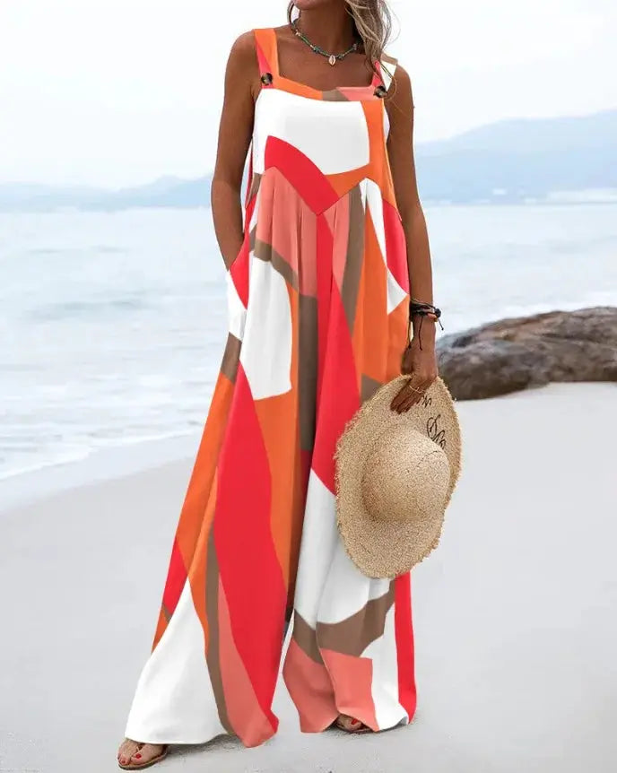 Sleeveless jumpsuit by Simples Market with orange-red geometric pattern and wide legs, beachwear.