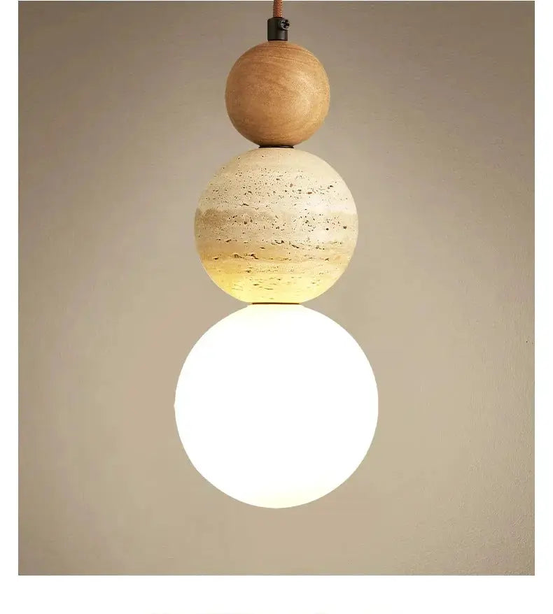 Cream-style pendant lamp with three stacked globe orbs in wood and stone tones, warm white LED