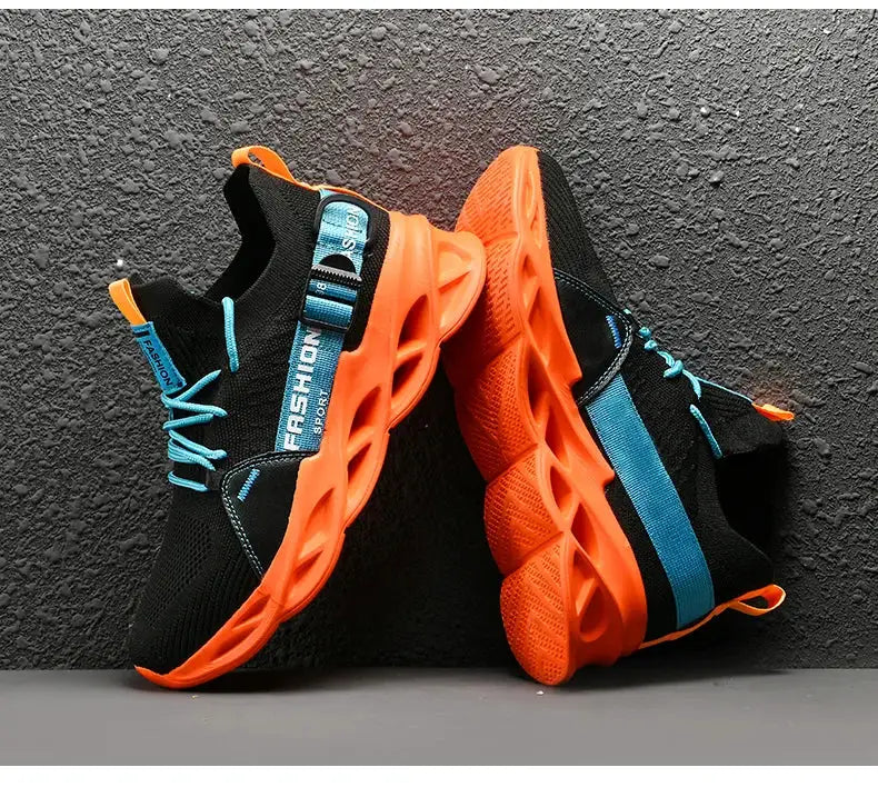 Sneakers with black mesh upper, bright orange thick sole, and teal laces and accents