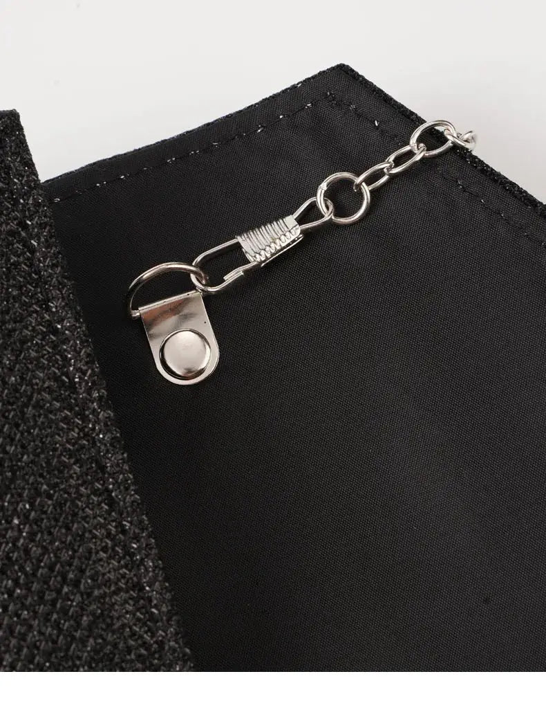Women envelope evening bag in black fabric with silver chain hardware