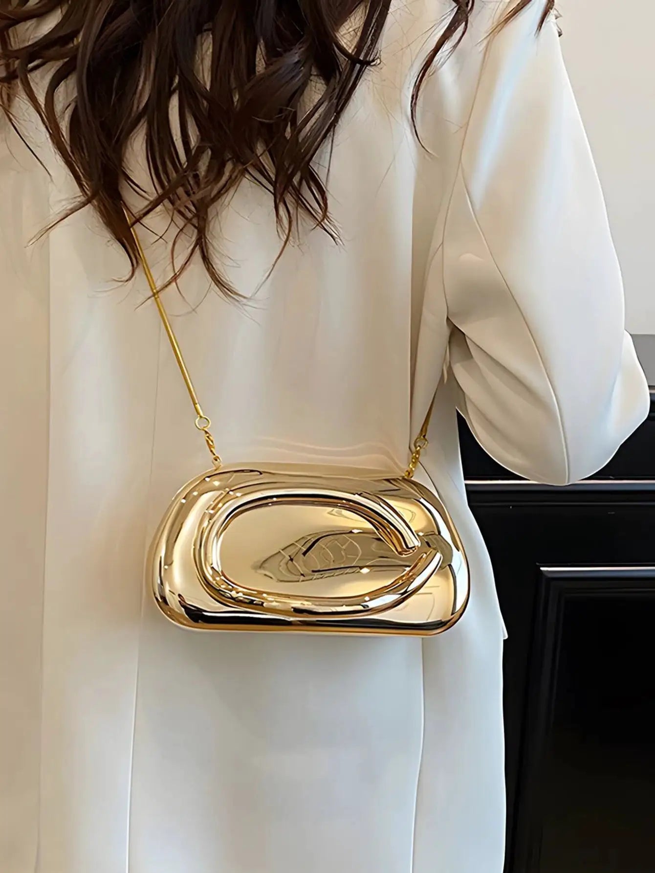 Acrylic box-shaped crossbody bag in shiny gold with a gold-tone chain strap