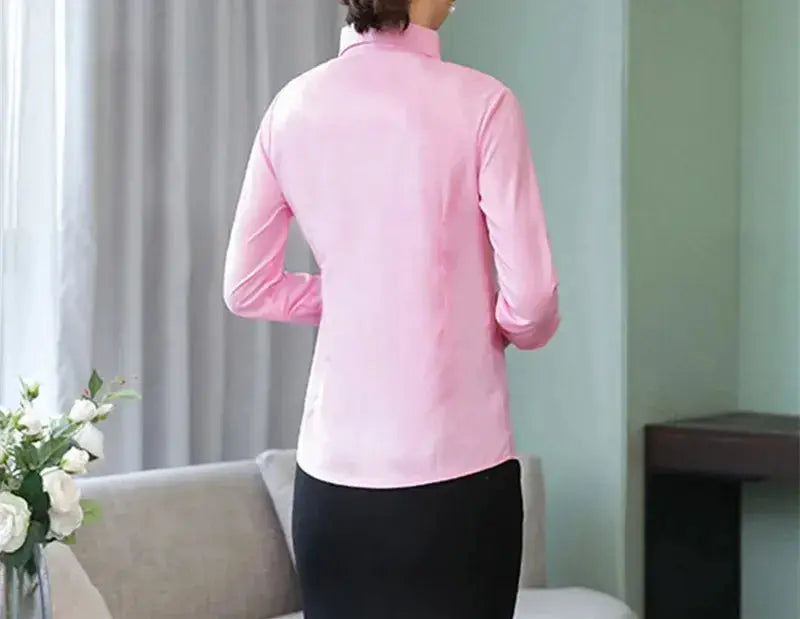 Pink women's long-sleeve blouse by Simples Market, back view.