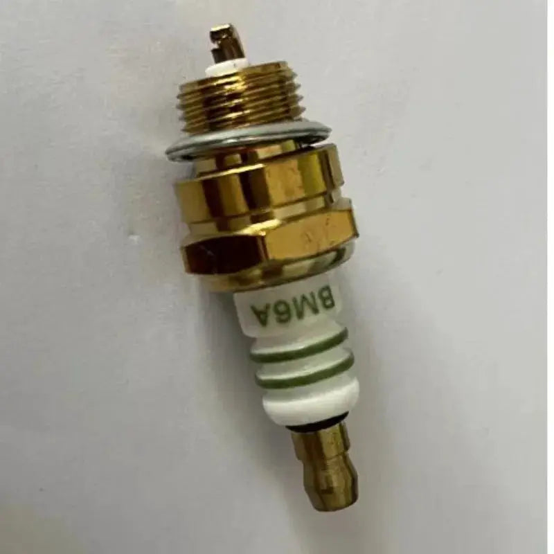 BM6A spark plug for small engines; gold-tone metal body with white ceramic insulator