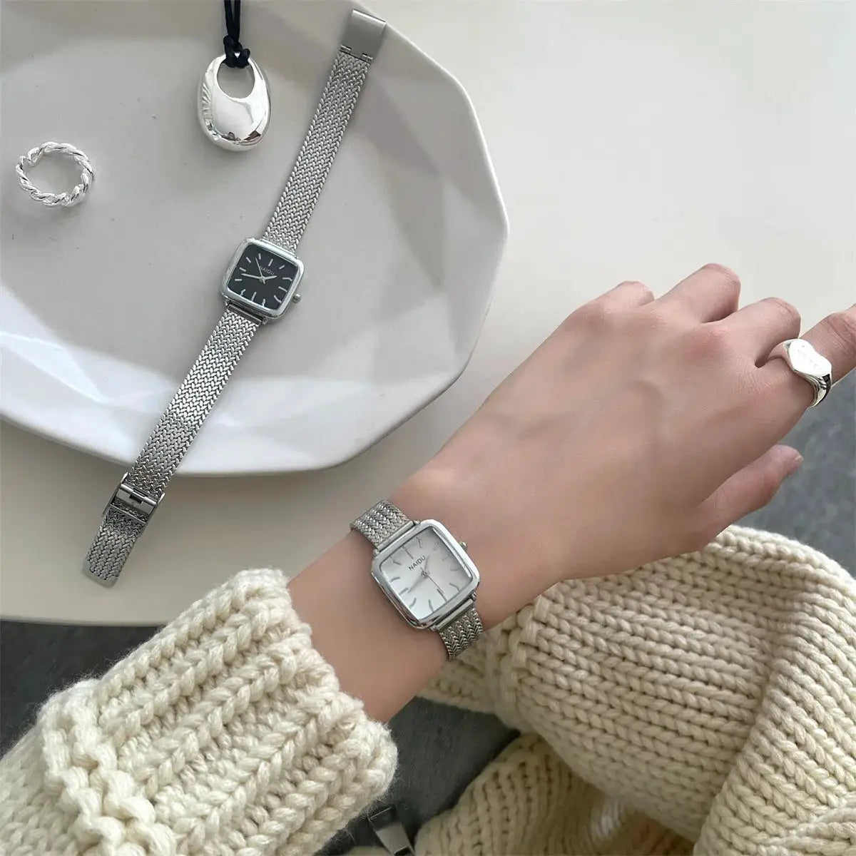 Simples Market women's quartz watches; two rectangular-dial stainless steel mesh-band timepieces with black and white dials