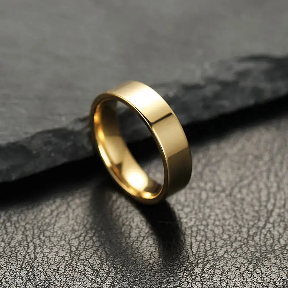 Unisex stainless steel ring with a gold-toned, wide smooth band