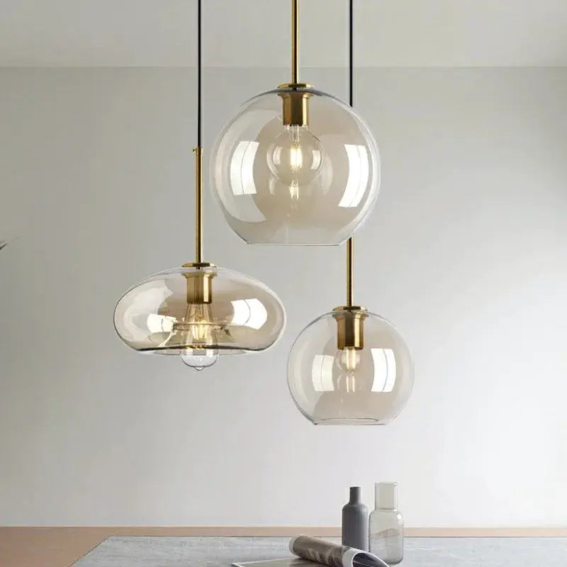 Nordic LED Glass Chandelier by Simples Market with three clear glass globe pendants and brass fittings