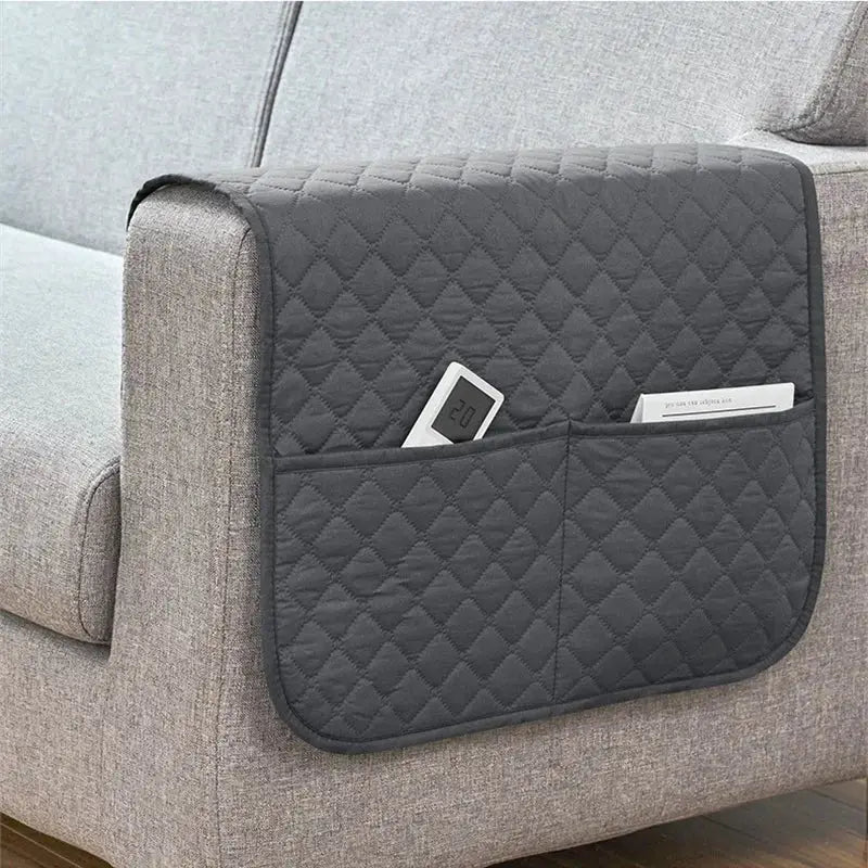 Sofa armrest slipcover with pockets for remote and card in dark gray quilted fabric, water-repellent