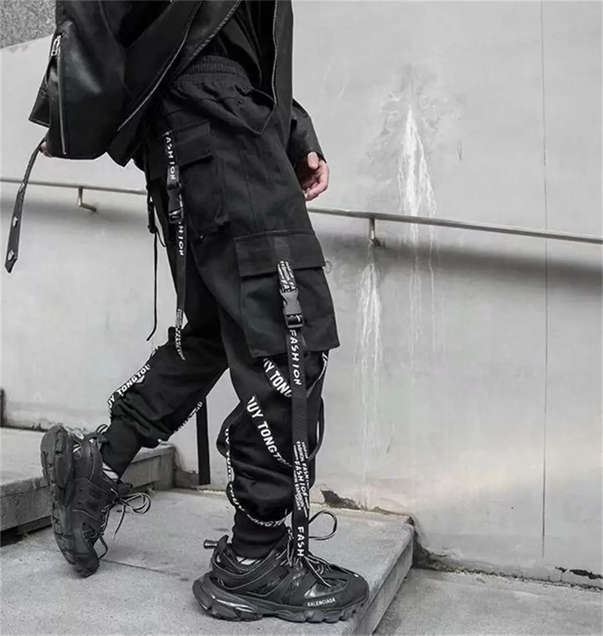 Black cargo pants for men by Simples Market with straps and multiple pockets
