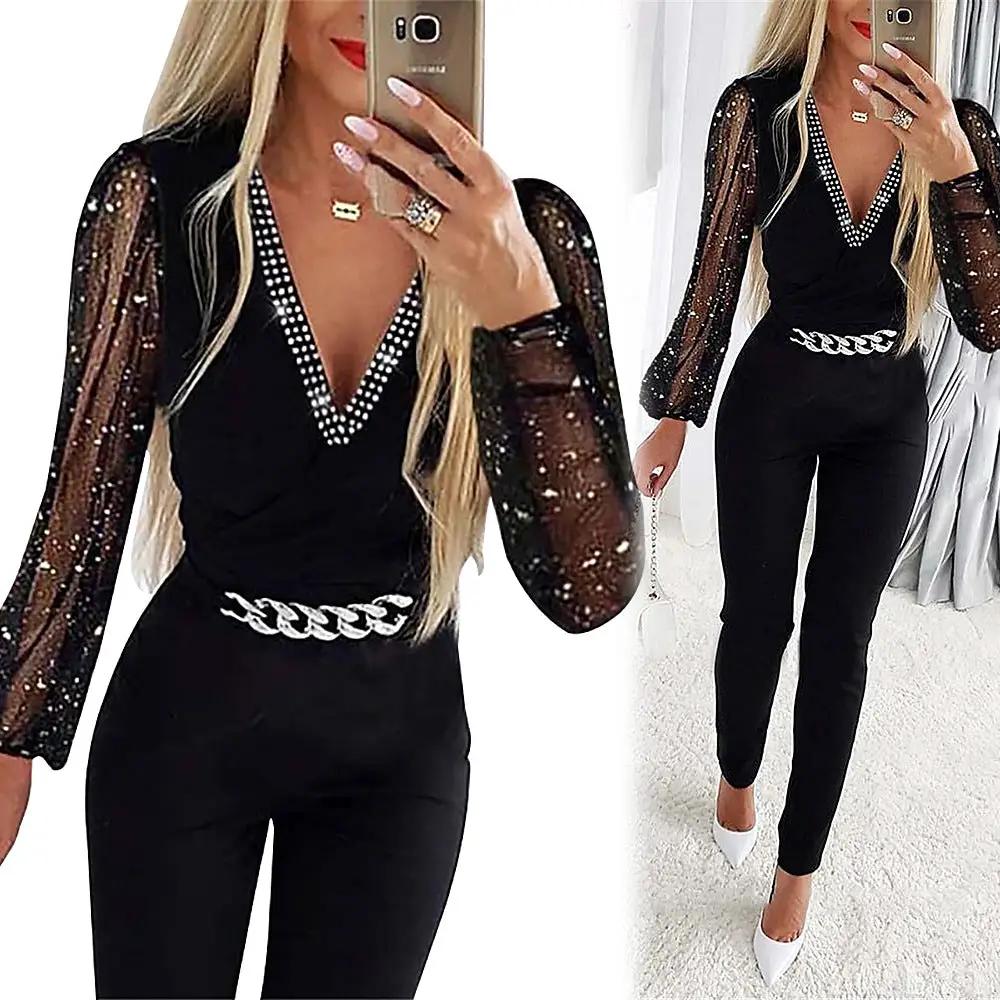 Simples Market black jumpsuit with V-neck rhinestone trim, sheer sequin sleeves, high-waist and chain belt.