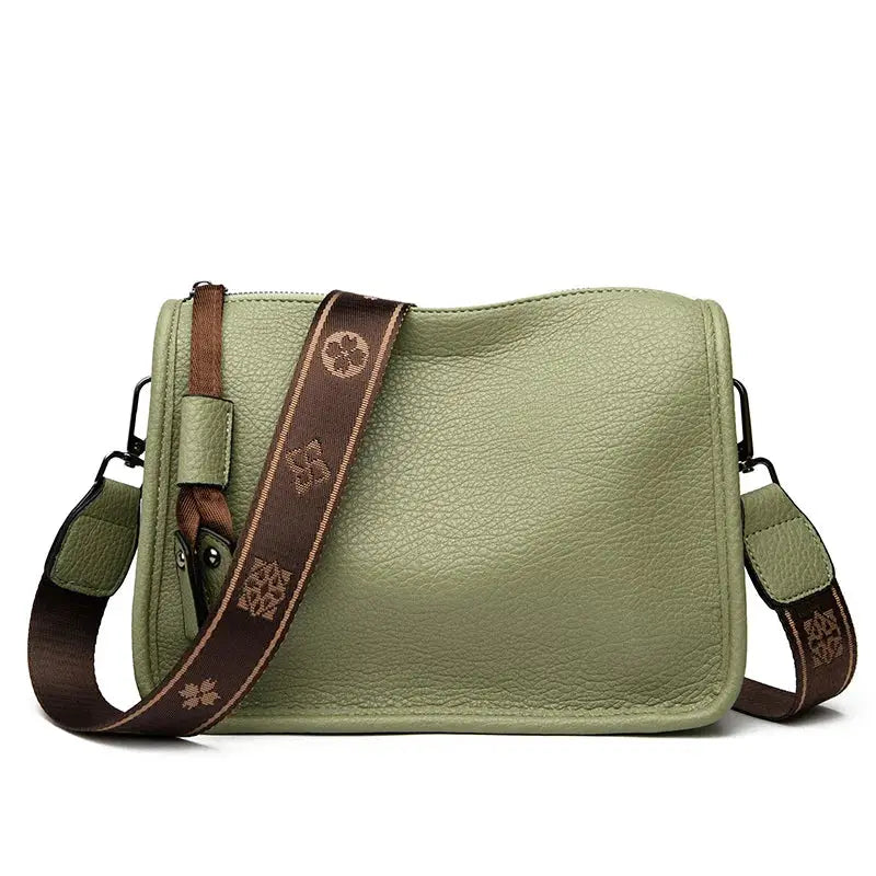 Leather crossbody bag by Simples Market in olive green with brown adjustable strap