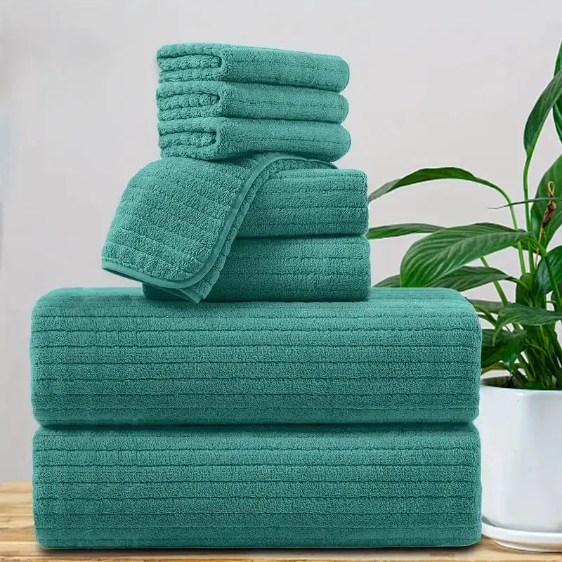 8-piece teal towel set with 2 bath towels, 2 face towels, and 4 washcloths