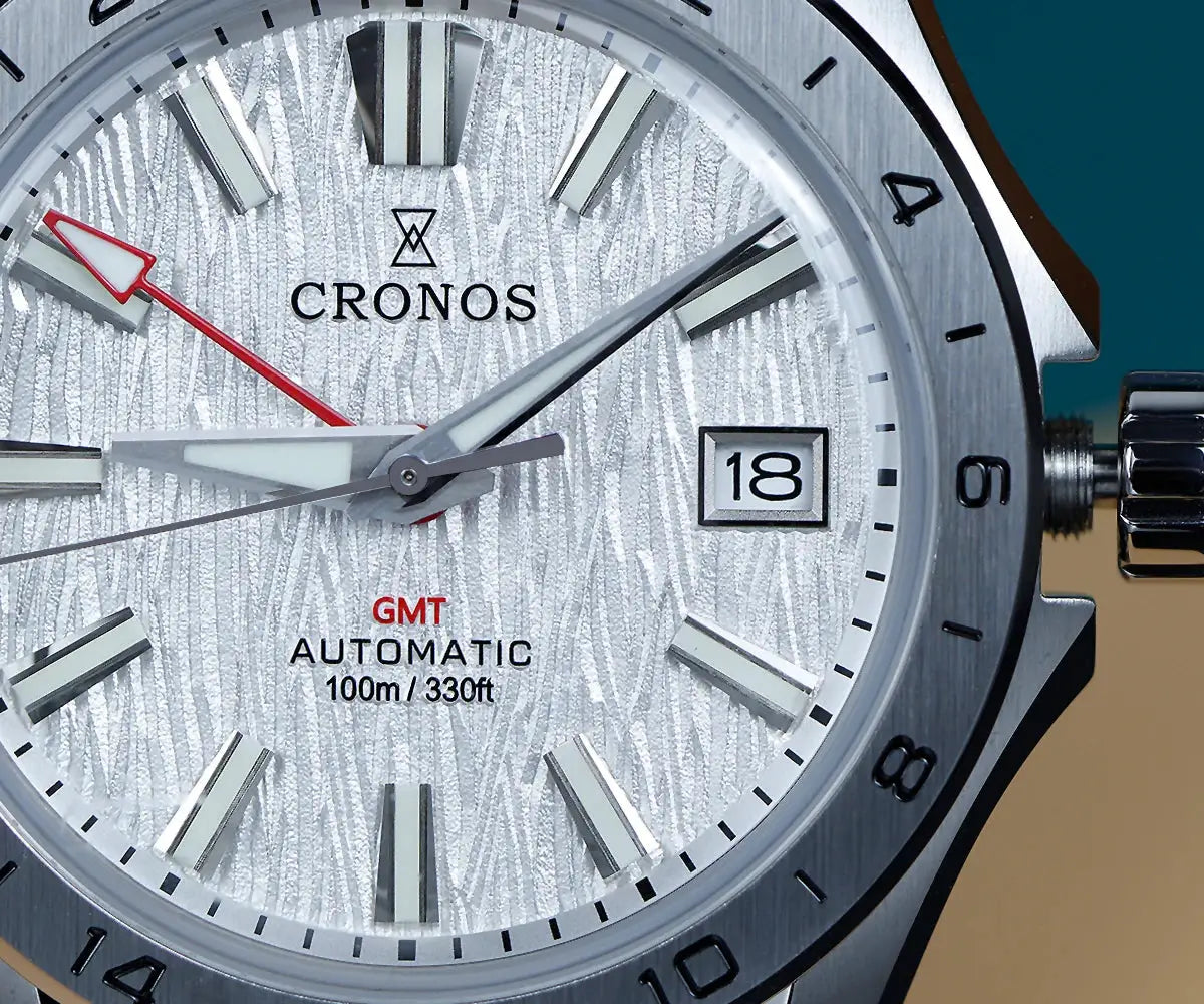 Cronos GS mechanical watch with birch-pattern silver dial, GMT automatic, date window 18, brushed stainless bracelet