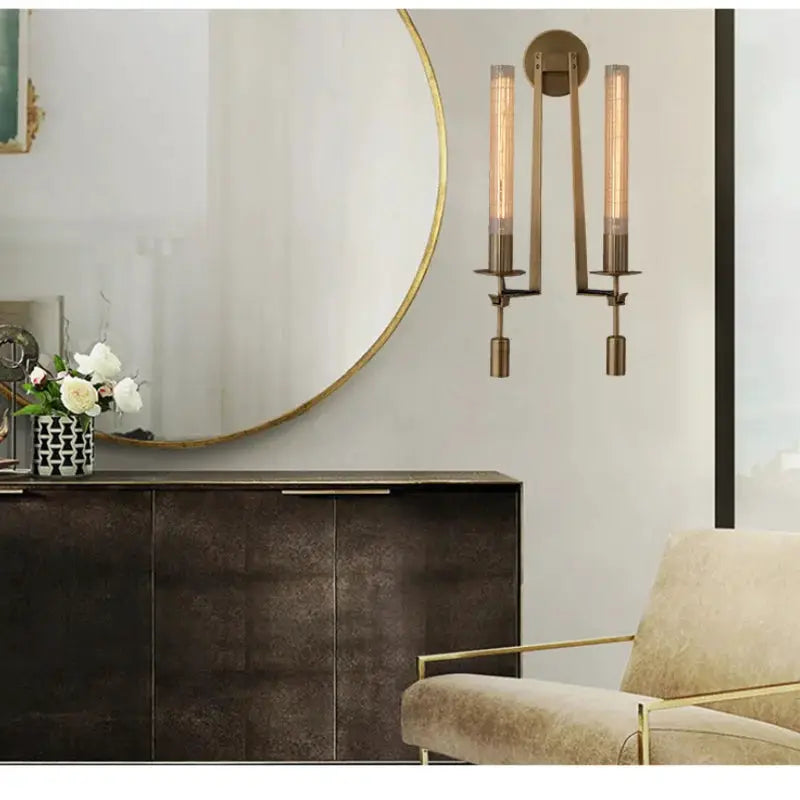 Modern copper wall sconce lamp with two vertical cylindrical bulbs, wall-mounted decor.
