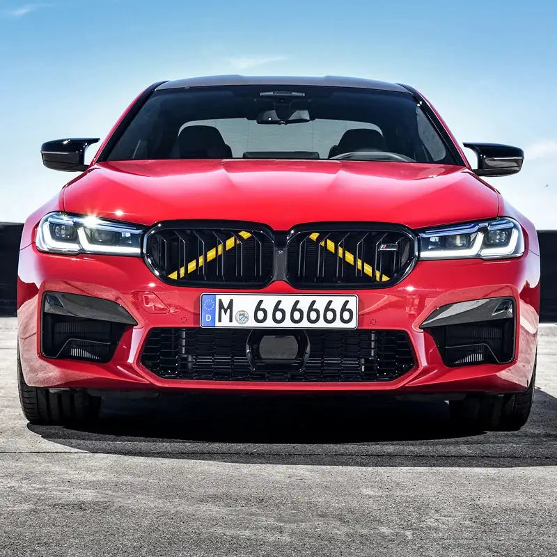 Car Front Grille Trim Strips for BMW; red vehicle with black kidney grilles and European license plate