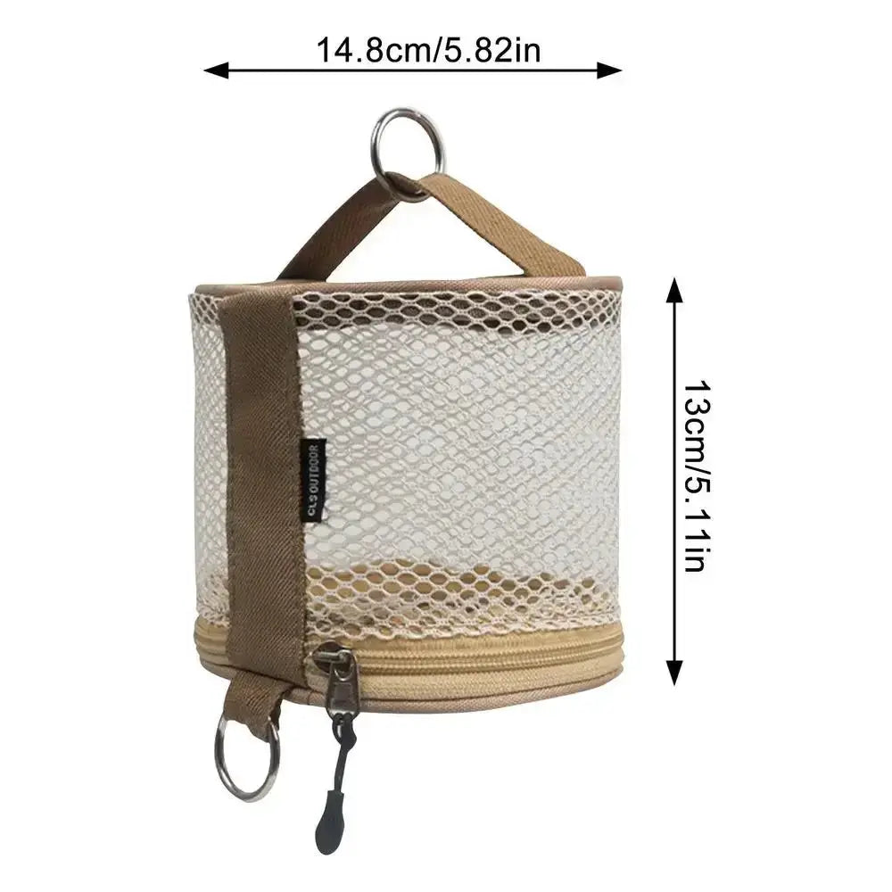 Simples Market camping tissue case, beige mesh hanging holder with brown strap and metal hook.