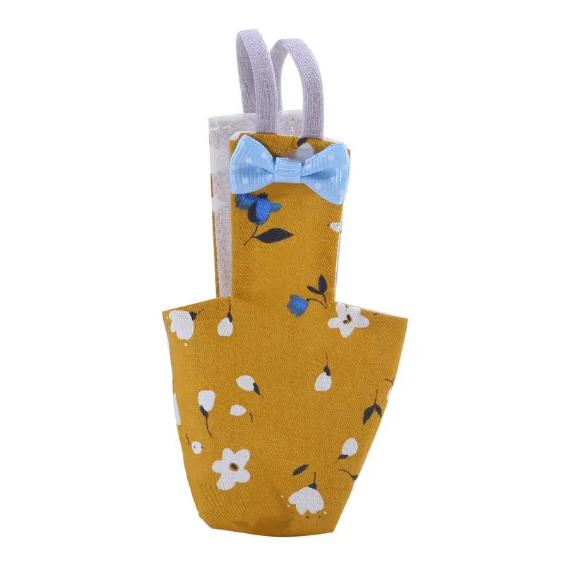 Parrot diaper with bowtie for small birds, yellow floral fabric with blue bow and lavender straps