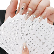 6 sheets of metal silver nail stickers with 3D star, heart and moon decals.