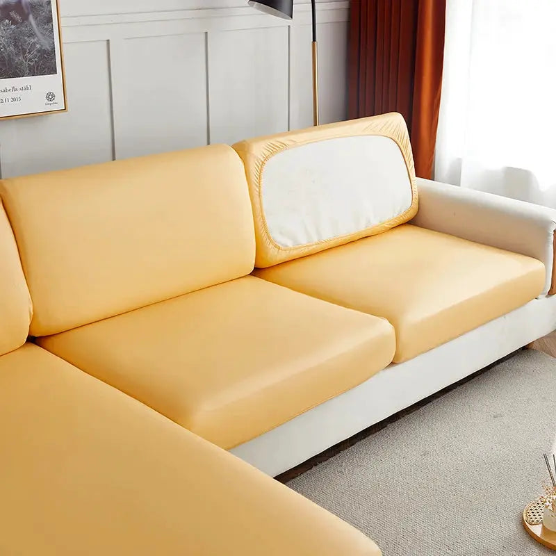 Corner sofa slipcover in solid yellow PU waterproof fabric; elastic stretch protector by Simples Market