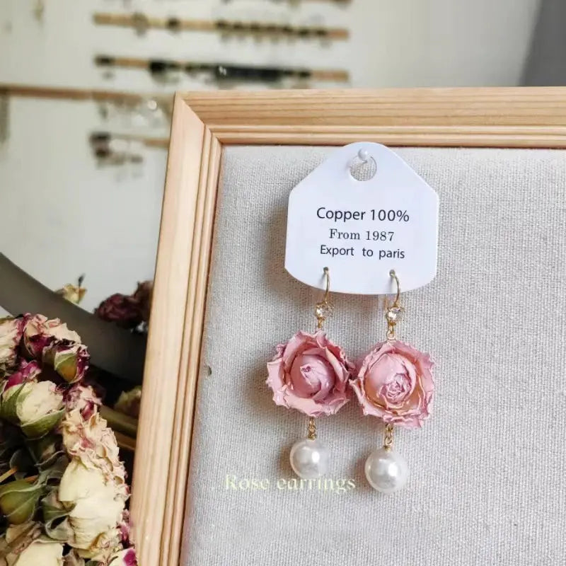 2 pink rose epoxy resin long earrings with pearl drops on gold hooks